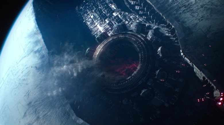 Starkiller Base in front of a planet with smoke leaking out of it