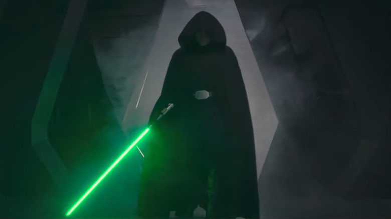 Luke Skywalker holding a green lightsaber