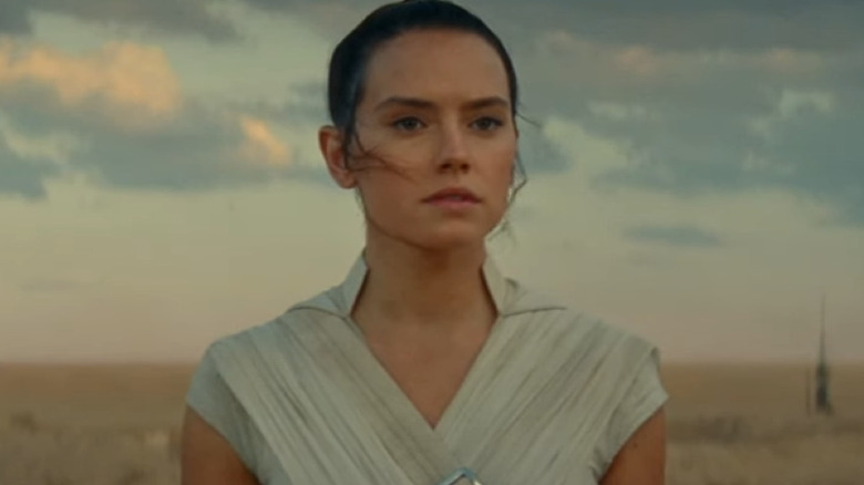 Rey standing in a field 