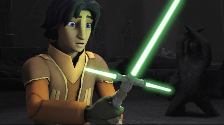 Ezra holding green crossguard lightsaber