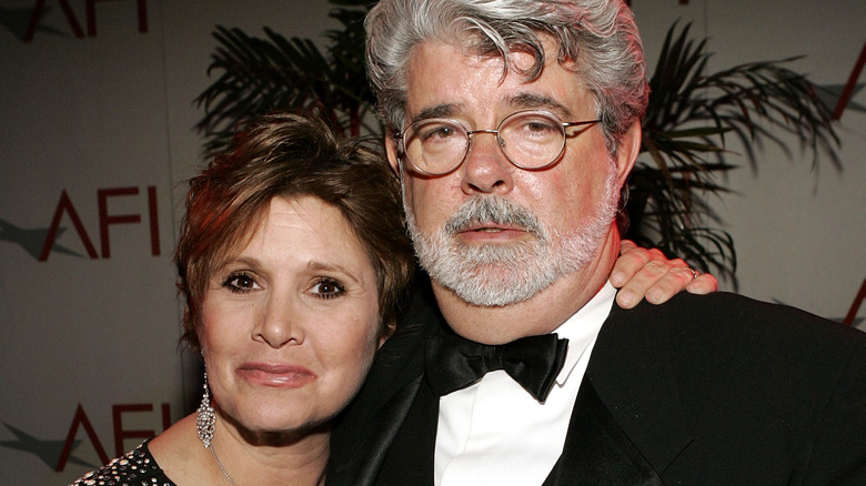 Carrie Fisher and George Lucas standing together