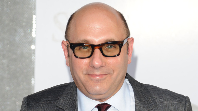 Willie Garson gives a slight smile