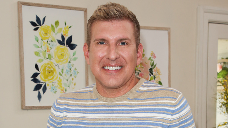 Todd Chrisley with flower portrait