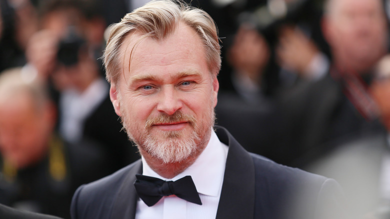 Christopher Nolan smiles