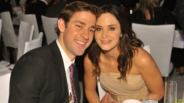 John Krasinski and Emily Blunt smile