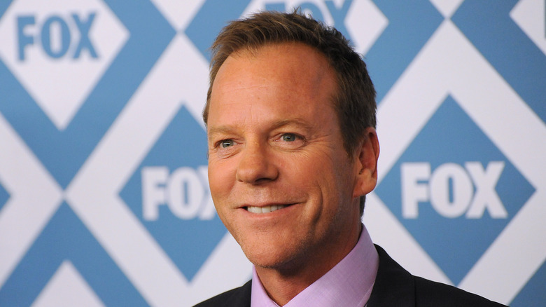 Kiefer Sutherland smiling at premiere