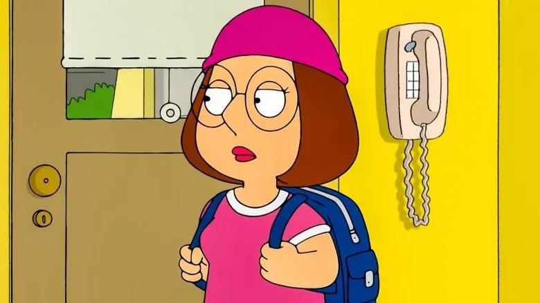 Meg holding her backpack