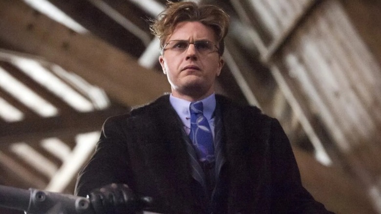 Mason Verger stands at railing