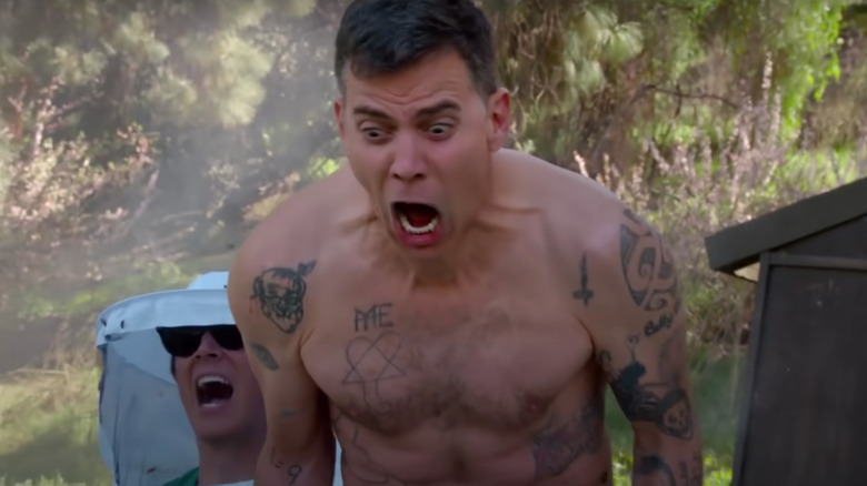 Steve-O shirtless and screaming