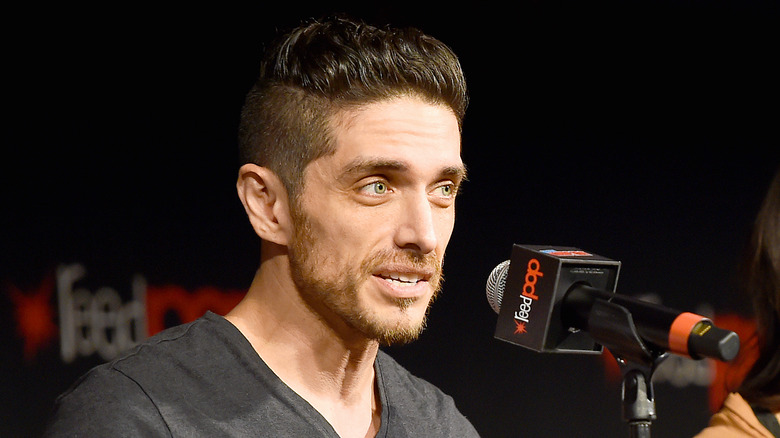 Josh Keaton speaking microphone