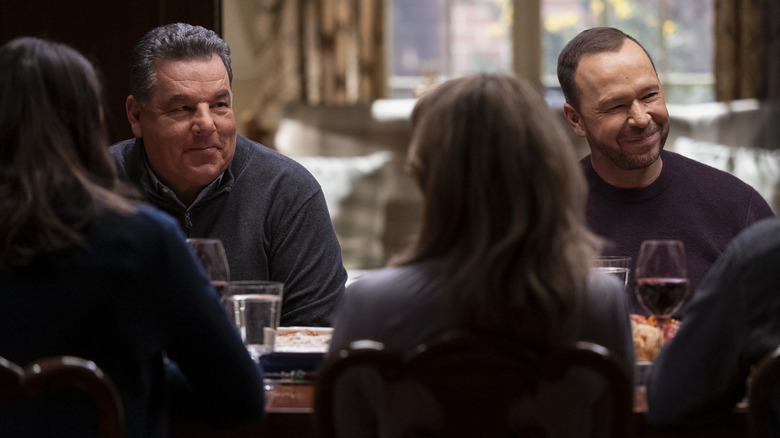Steve Schirripa as Anthony Abetemarco and Donnie Wahlberg as Danny Reagan at dinner table in Blue Bloods