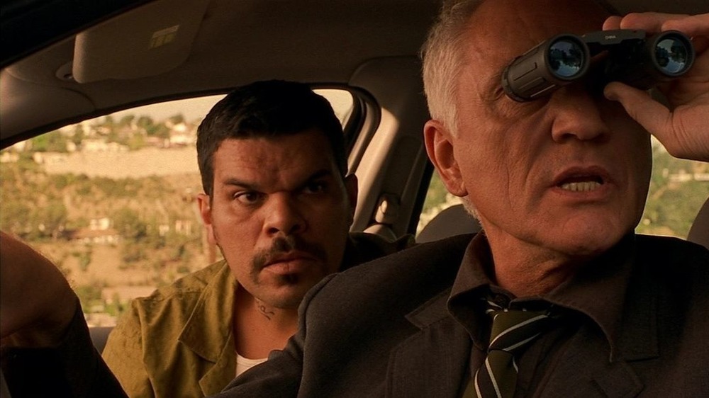 Luis Guzman and Terence Stamp spying