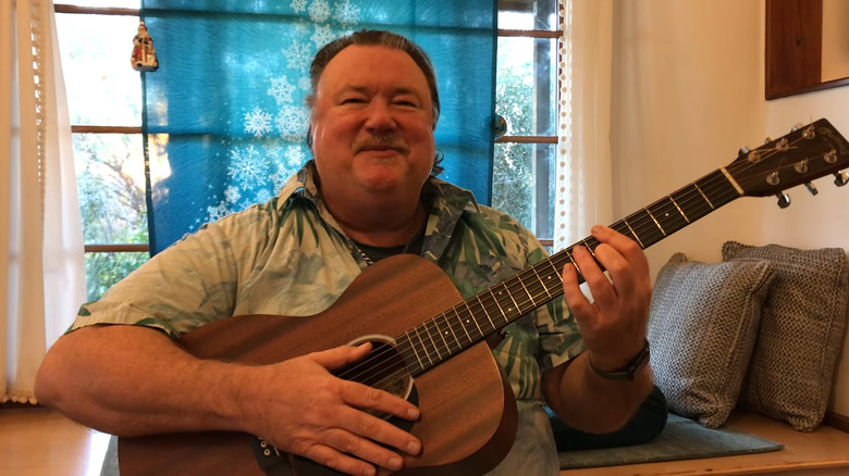 Maurice playing the guitar