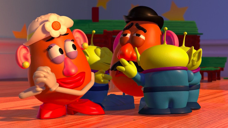 Aliens hugging Mr. Potato Head