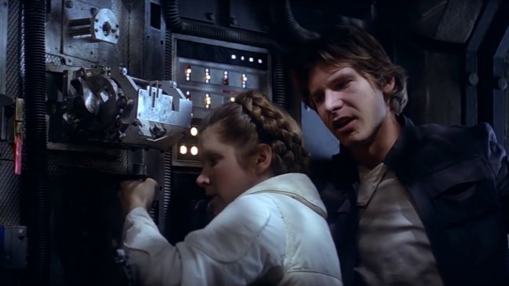 Harrison Ford as Han Solo getting handsy with Carrie Fisher as Princess Leia in Star Wars: The Empire Strikes Back