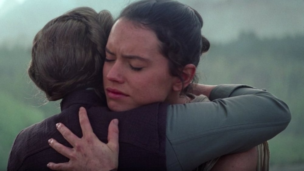 Carrie Fisher as General Leia hugs Daisy Ridley as Rey after Han's death in Star Wars: The Force Awakens