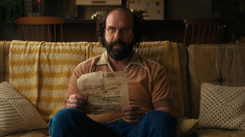 Murray on the couch reading Hopper's letter