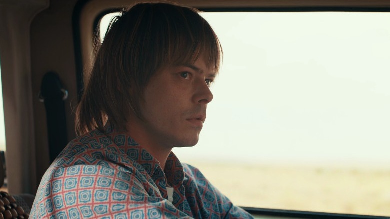 Jonathan Byers looking in the rearview mirror
