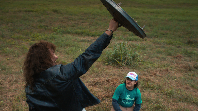 Eddie holding shield with Dustin