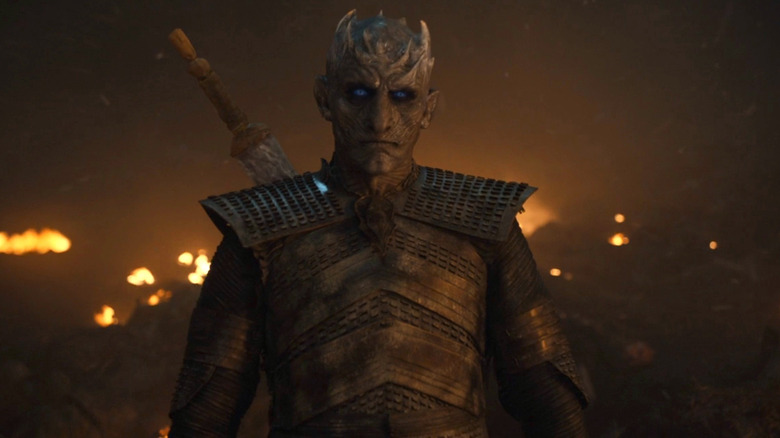 Night King stands on a fiery battlefield