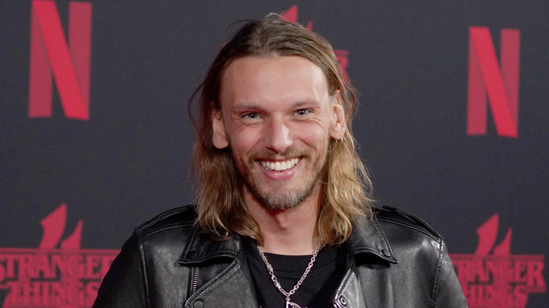 Jamie Campbell Bower smiling