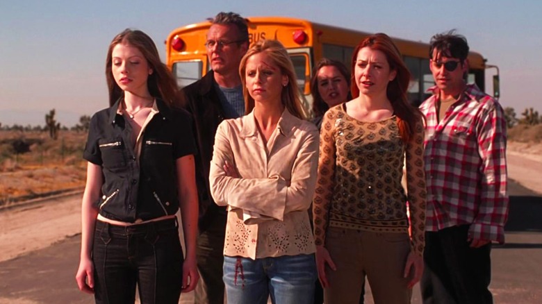 Buffy and her friends standing in front of a school bus