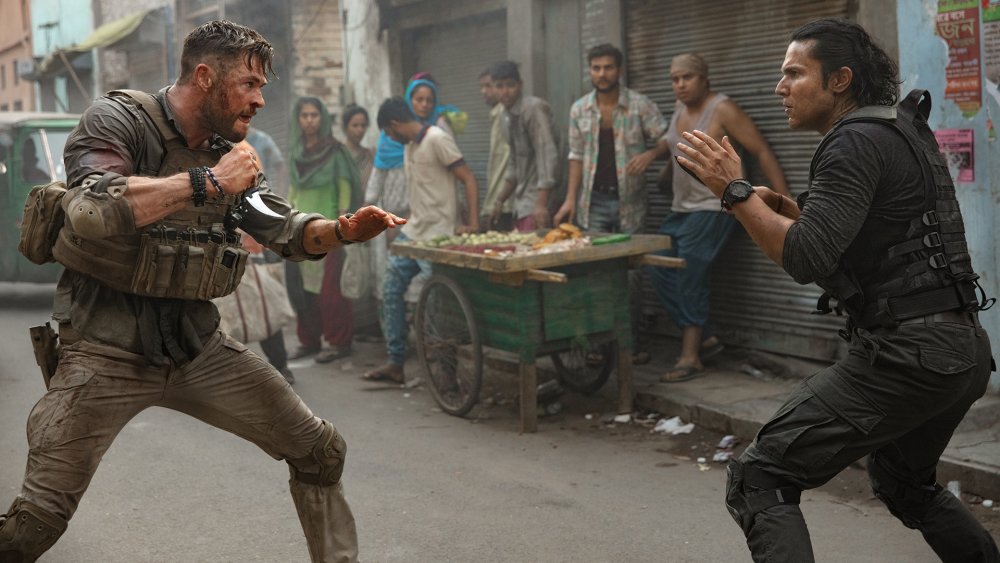 Chris Hemsworth and Randeep Hooda as Tyler Rake and Saju Rav in Extraction