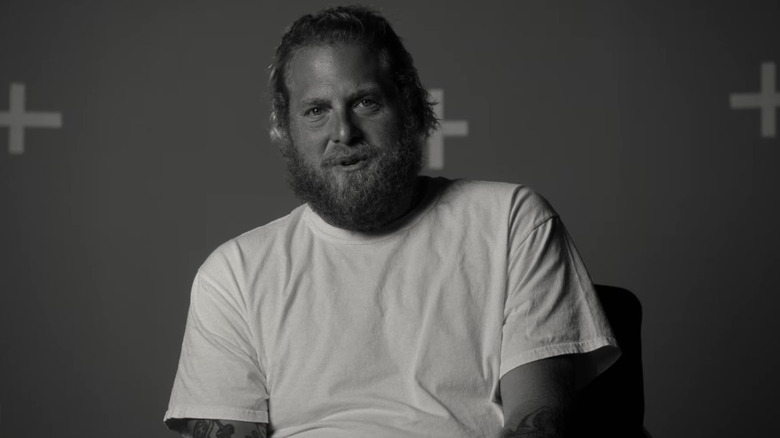 Jonah Hill smiling in black and white 