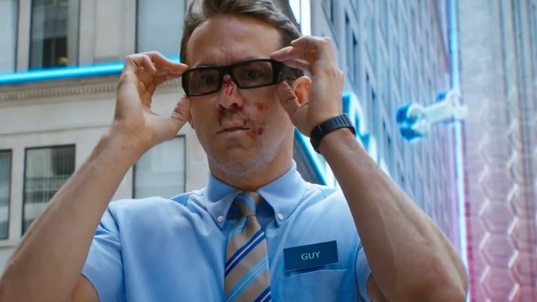 Ryan Reynolds tries on sunglasses