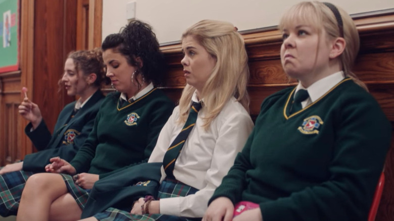 Derry girls sitting together