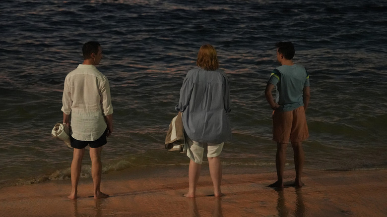 The Roy siblings staring out at the water