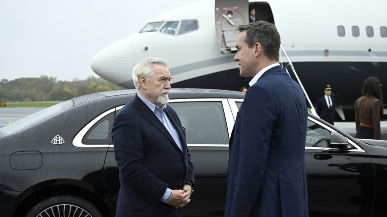 Logan and Tom standing by plane