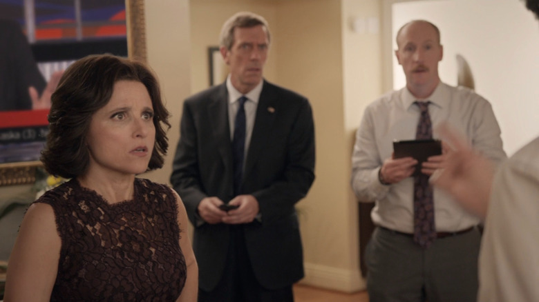 Selina Meyer, Tom James, and Mike McClintock look dumbfounded at a screen