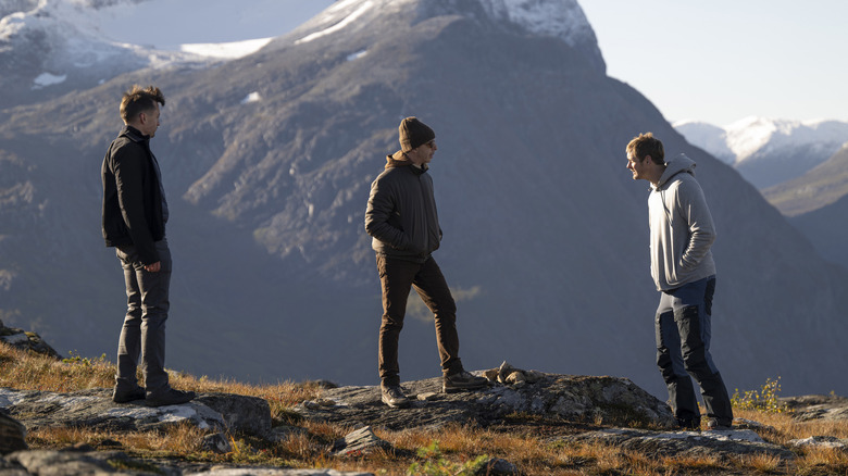 Roman and Kendall Roy facing Lukas Matsson on a mountain