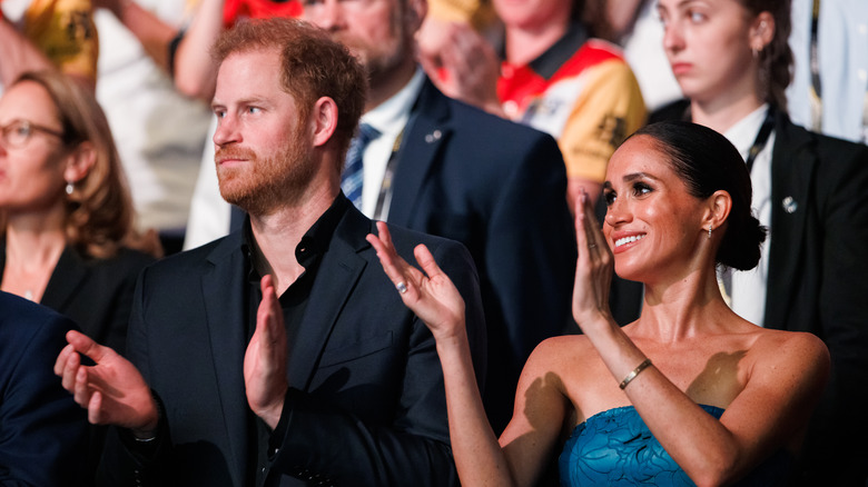 Meghan Markle and Prince Harry applauding