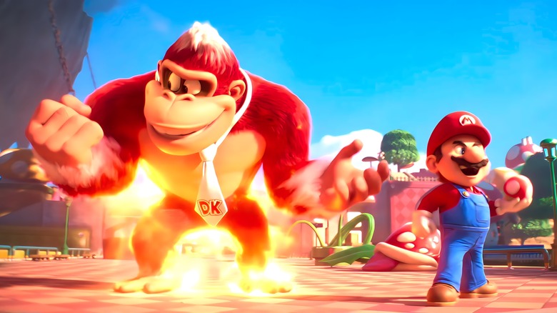 Donkey Kong is on fire and standing next to Mario