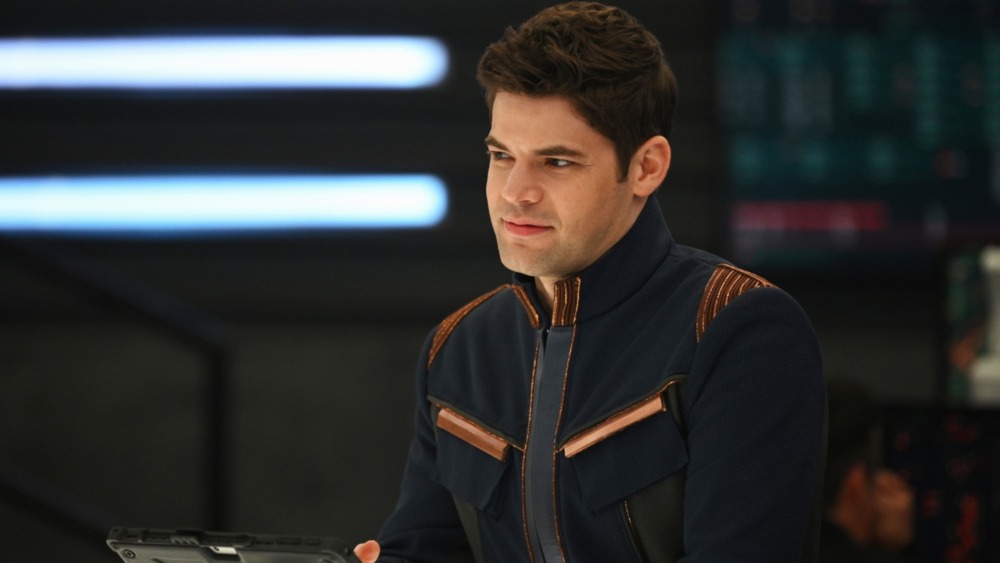 Winn at a desk