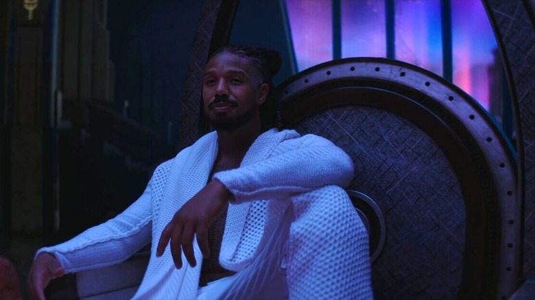 Killmonger sits on the throne