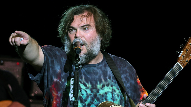 Jack Black singing and pointing on stage