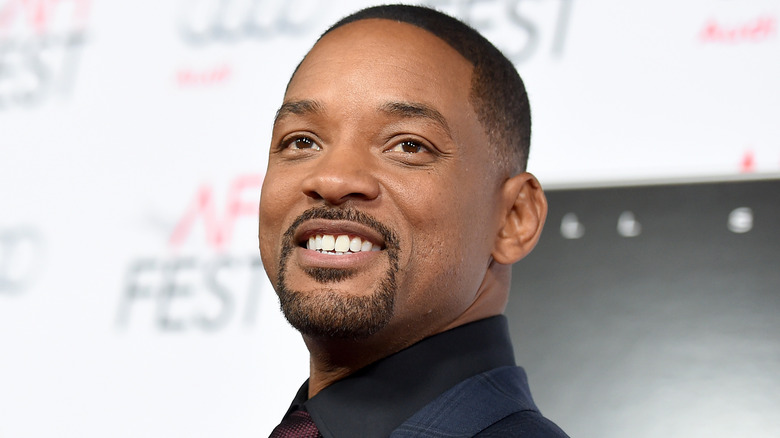 Will Smith looking up and smiling