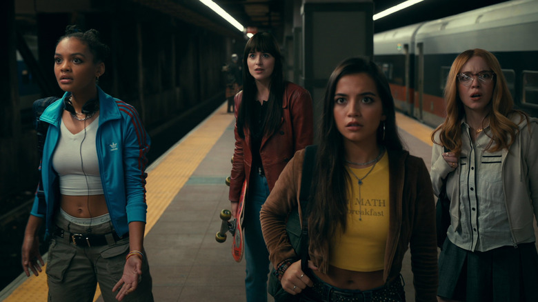 Cassie leads Mattie, Anya, and Julia in a subway in "Madame Web" (2024)