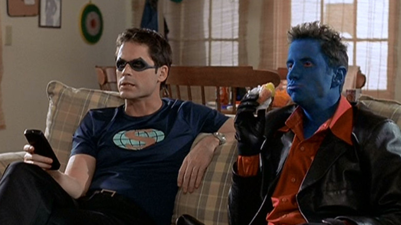 The Weevil and Amok sit on a couch in "The Specials" (2000)