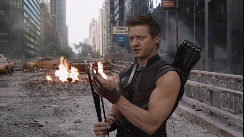 Hawkeye standing in wrecked street