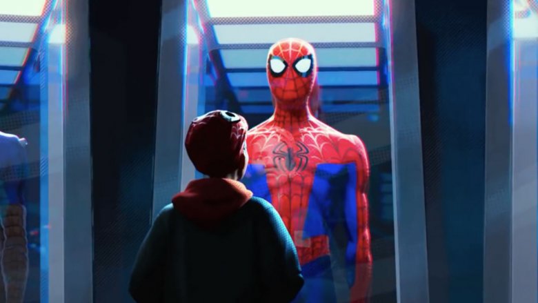 Miles Morales looking at one of the costumes of the deceased Peter Parker