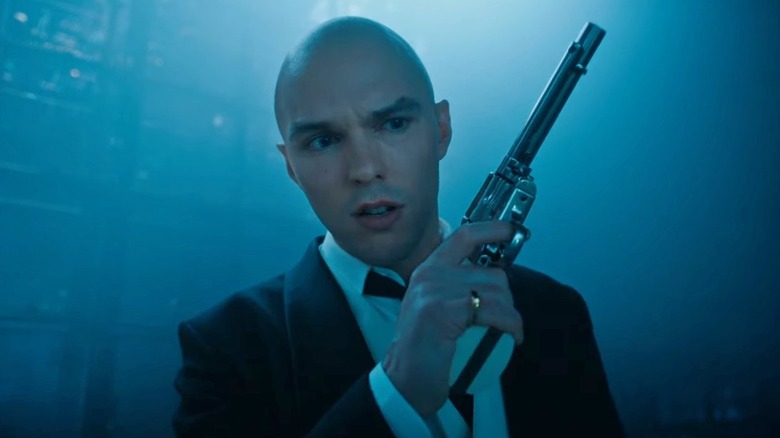 Lex Luthor holds a gun in "Superman" (2025)