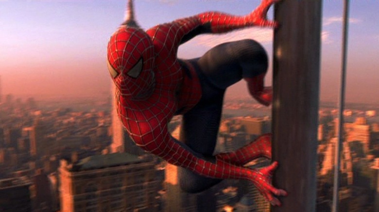 Spider-Man clinging to building