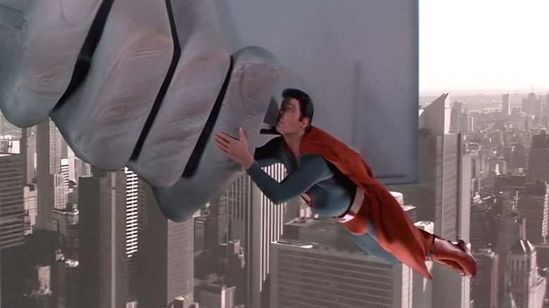 Superman carrying statue