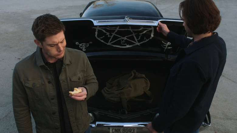 Sam and Dean open trunk