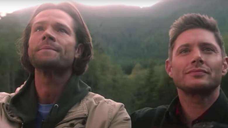 Sam and Dean stand on a bridge in Supernatural