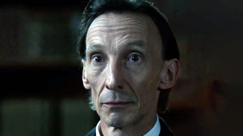 Julian Richings as Death looking curious